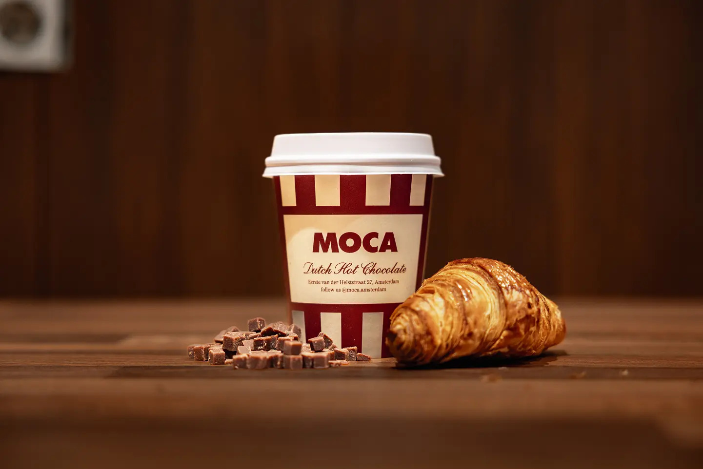 MOCA branded cup of Dutch hot chocolate served with a croissant
